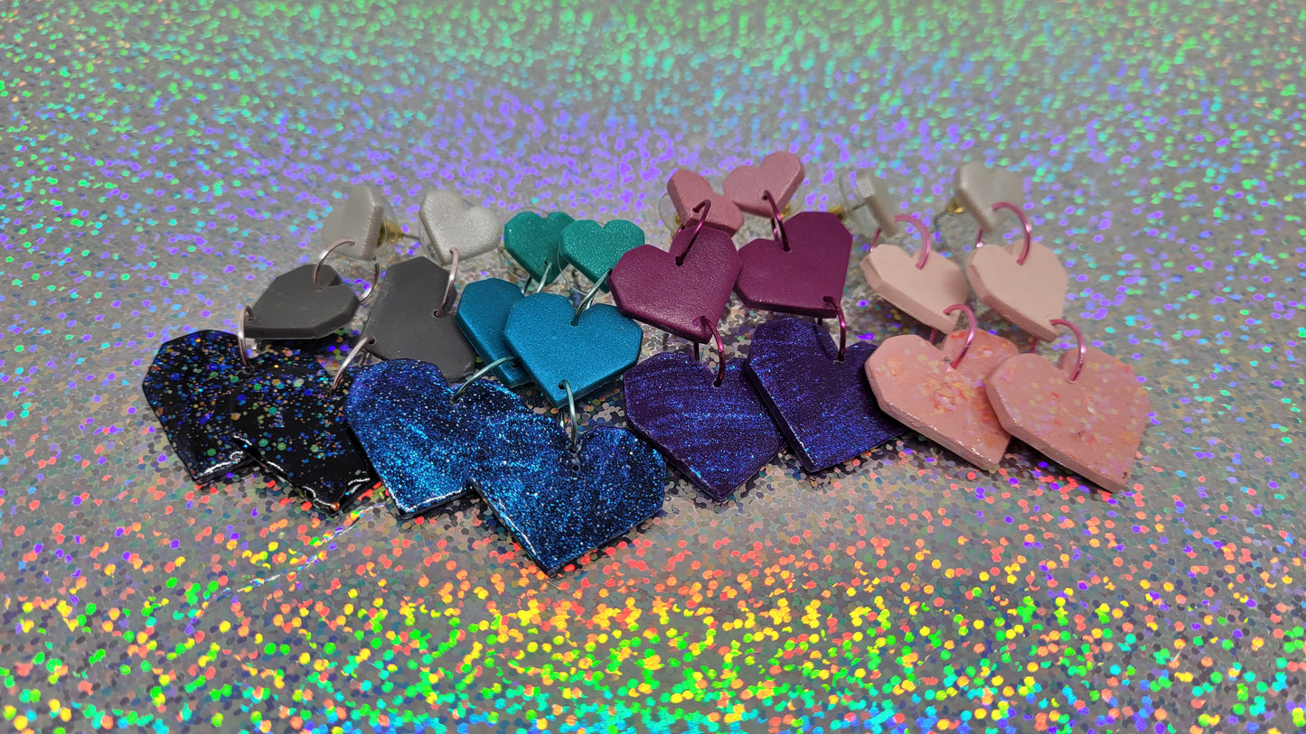 All four earring choices. From left to right: Silver/Gray/Black, Turquoise/Jade/Midnight Blue, Bubblegum Pink/Magenta/Royal Purple, White/Light Pink/ Flamingo Pink
