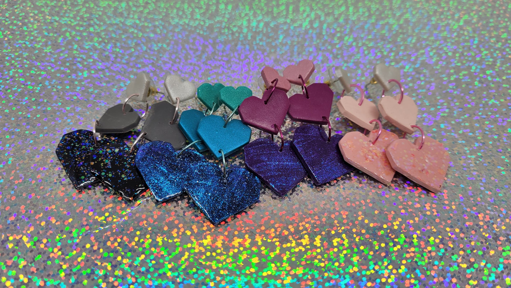 All four earring choices. From left to right: Silver/Gray/Black, Turquoise/Jade/Midnight Blue, Bubblegum Pink/Magenta/Royal Purple, White/Light Pink/ Flamingo Pink